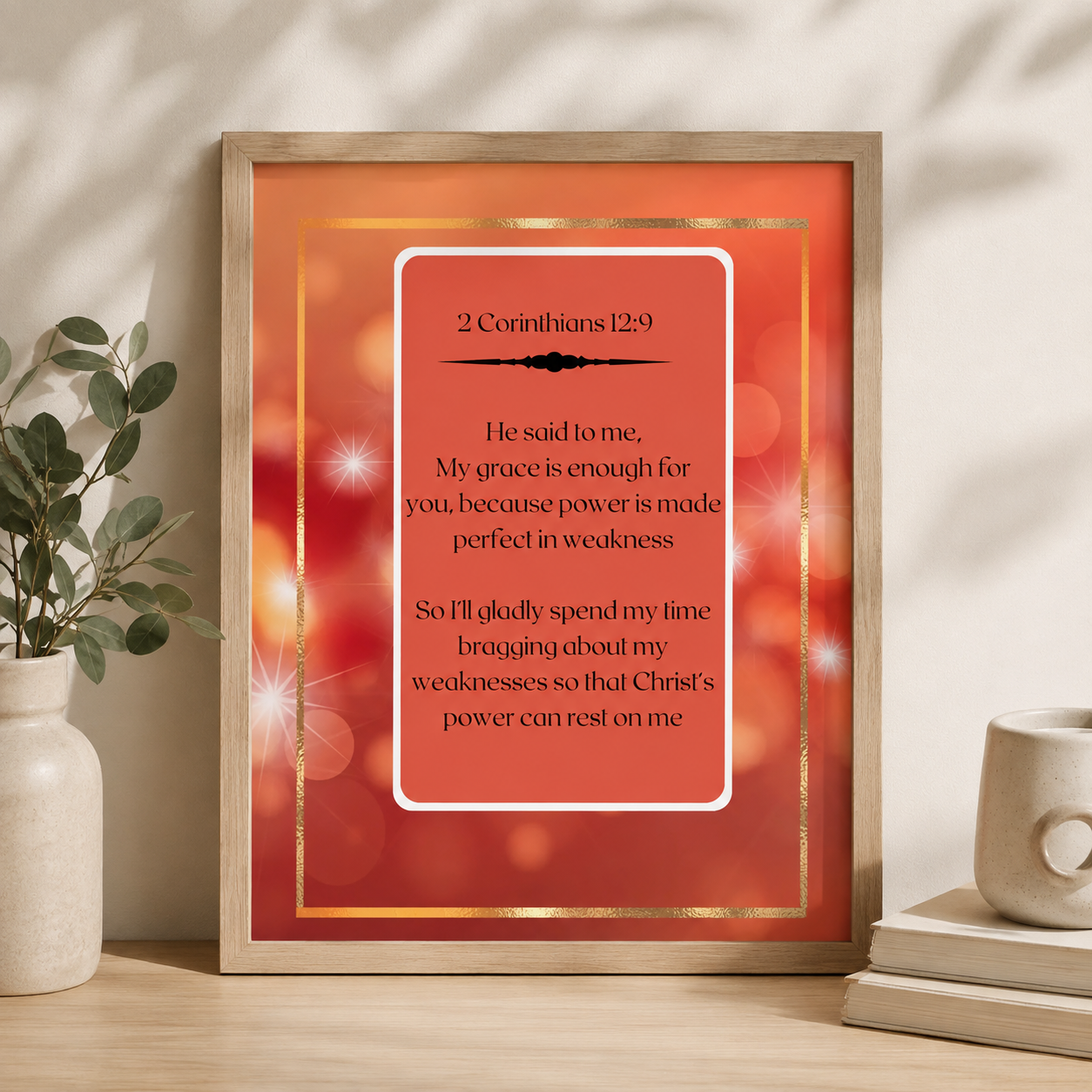 coral red 2 Corinthians 12:9 christian art sitting upright on a decorative desk.
