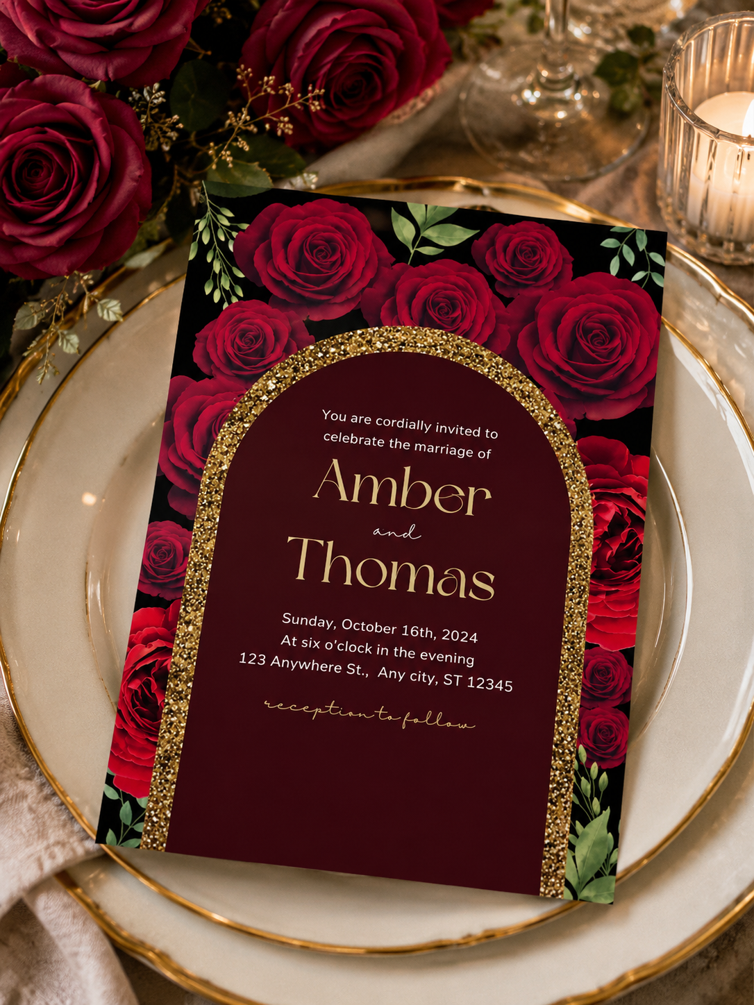A dramatic black and deep red wedding invitation featuring a gold glitter archway frame surrounded by crimson red roses.