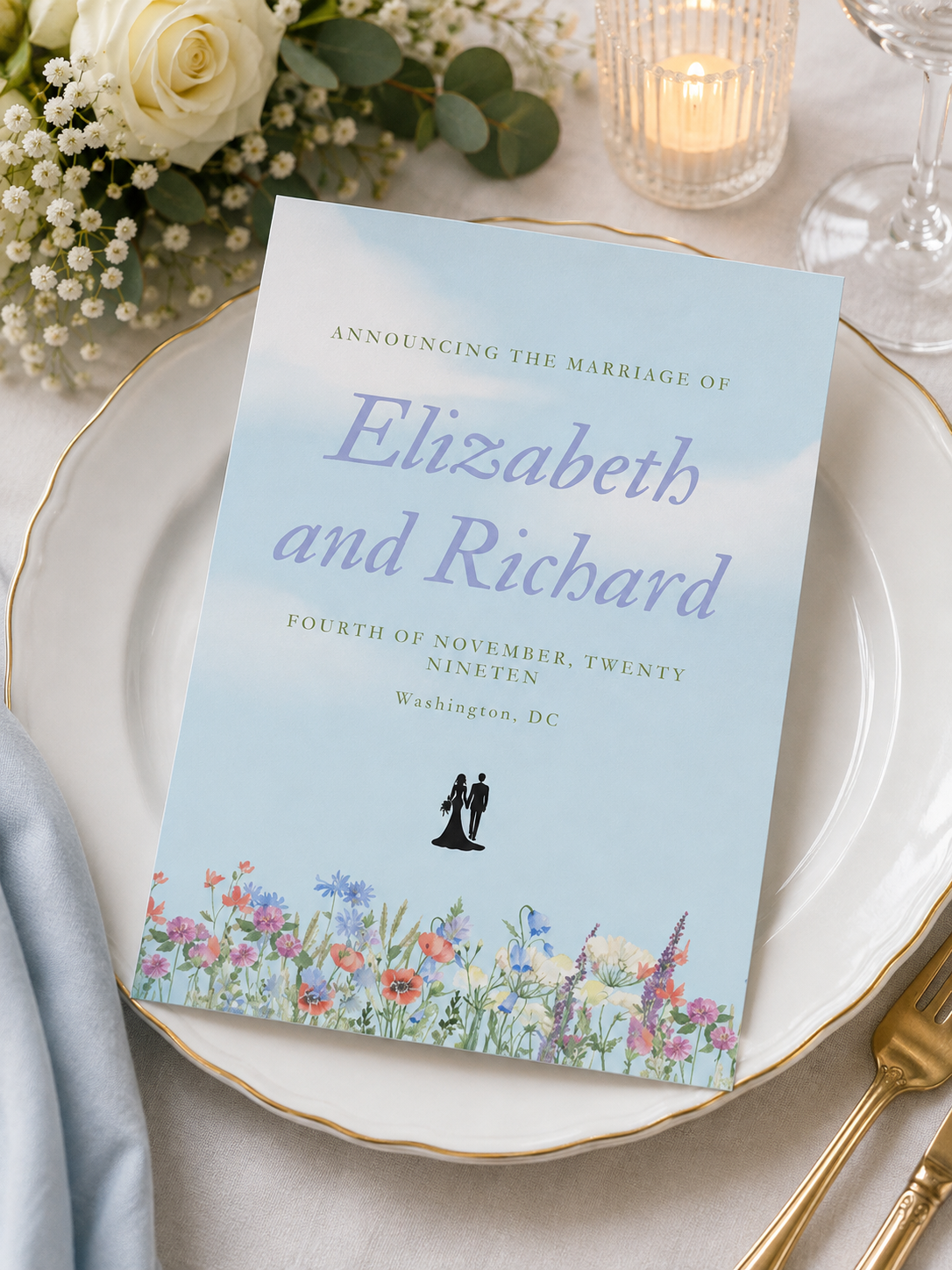 A marriage announcement card with a light blue watercolor sky background and a colorful meadow wildflower border.
